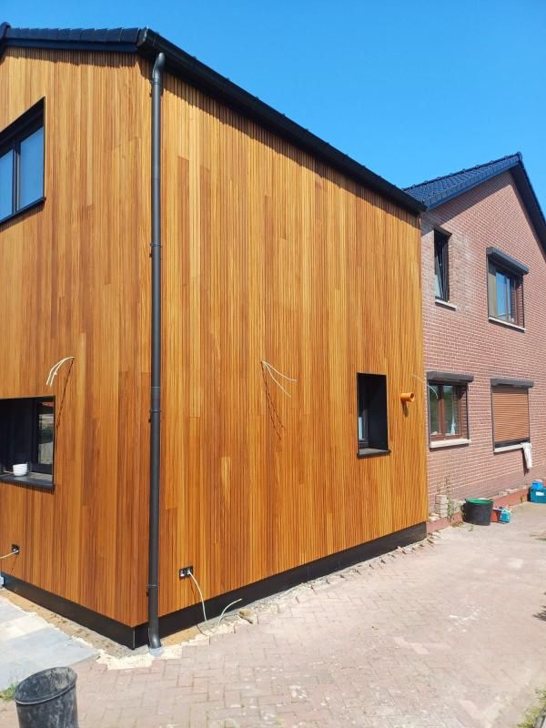 renovatie van leien naar pannen houtskeletbouw met bekleding ayous